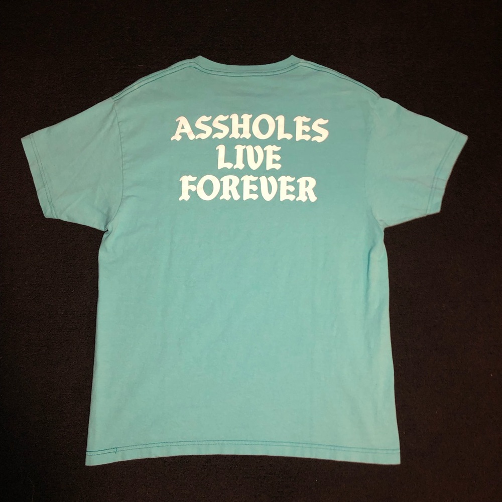 Assholes Live Forever. Size large. Light Blue color. Short Sleeve Shirt.